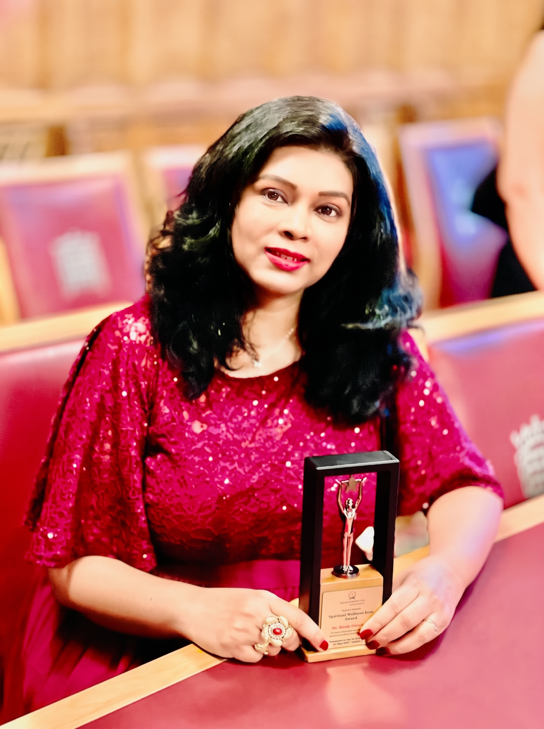 Bindu Bodanapu receiving the Spiritual Wellness Icon Award at the British Parliament, London